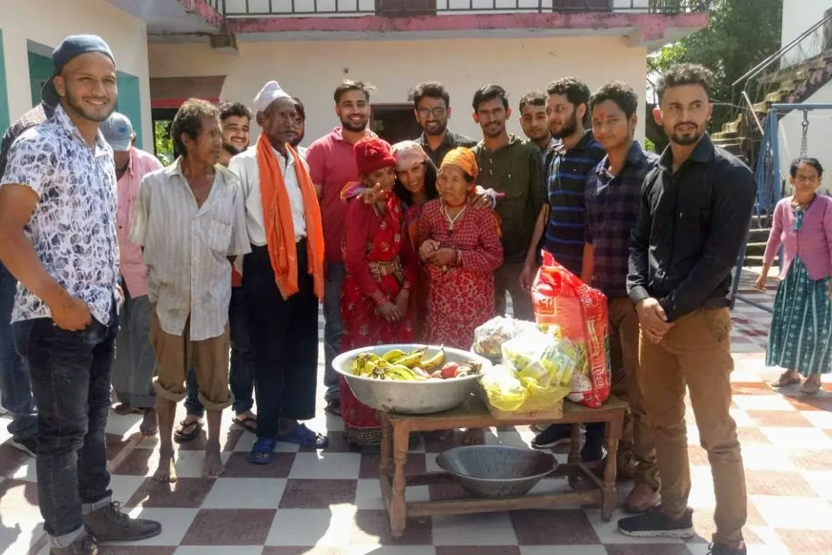 Sharing fruit and rice with the residents